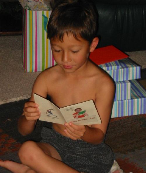 Matthew reading Ryan's birthday card