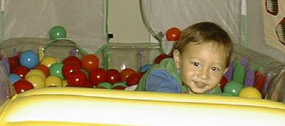Matthew in his ball pit