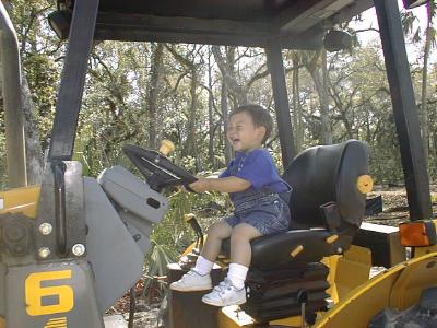 Matthew driving his new bulldozer